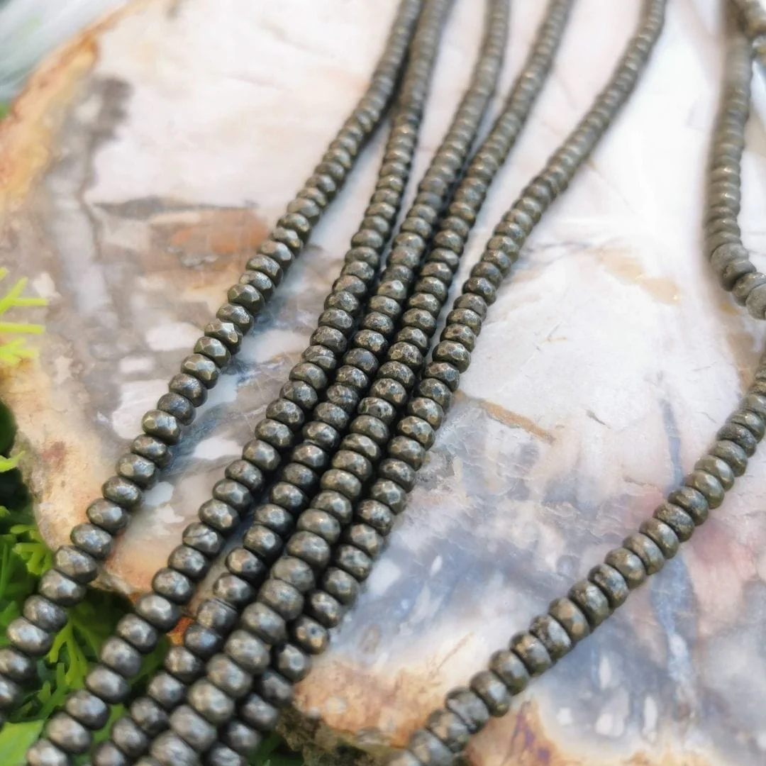 Perle rondelle facetté en Pyrite